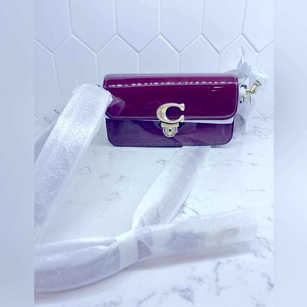 Red coach NWT. Shoulder strap or can remove it for a clutch.